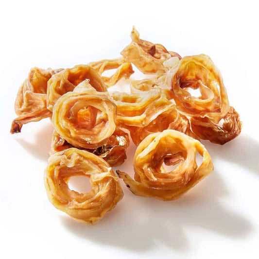 Curled veal tendon scrolls for dogs, natural long-lasting chew supporting dental health.